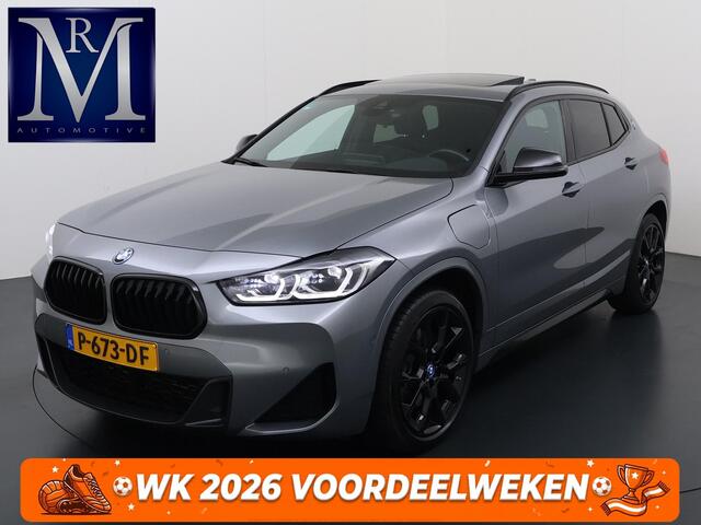 BMW X2 25e M SPORT Business Edition Plus VAN: 31.900,- VOOR: 29.330,- UW WKVOORDEEL: 2.570,- | BOMVOL | PHEV| PANO| NAP| STOEL + STUURVERWARMING| COMFORT ACCESS| ELEK. ACHTERKLEP| AFNEEMBARE TREKHAAK| HUD| ACHTERUITRIJCAMERA| APPLE CARPLAY