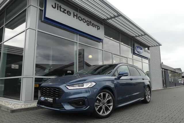 Ford Mondeo VCT HEV ST-Line WINTER PACK, MEMORY, ADAPT. CRUISE, CLIMA, NAVI, CAMERA, PDC V&A, APPLE CARPLAY/ANDROID AUTO, BLIS, KEYLESS, ELEKT. ACHTERKLEP, ELEKT. PASSAGIERSSTOEL, 54.035KM
