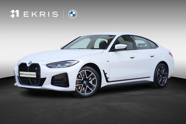 BMW i4 40 84 kWh | M-Sport Pakket | PDC | Achteruitrijcamera | Harman Kardon | Active cruise | Verwarmde Voorstoelen |